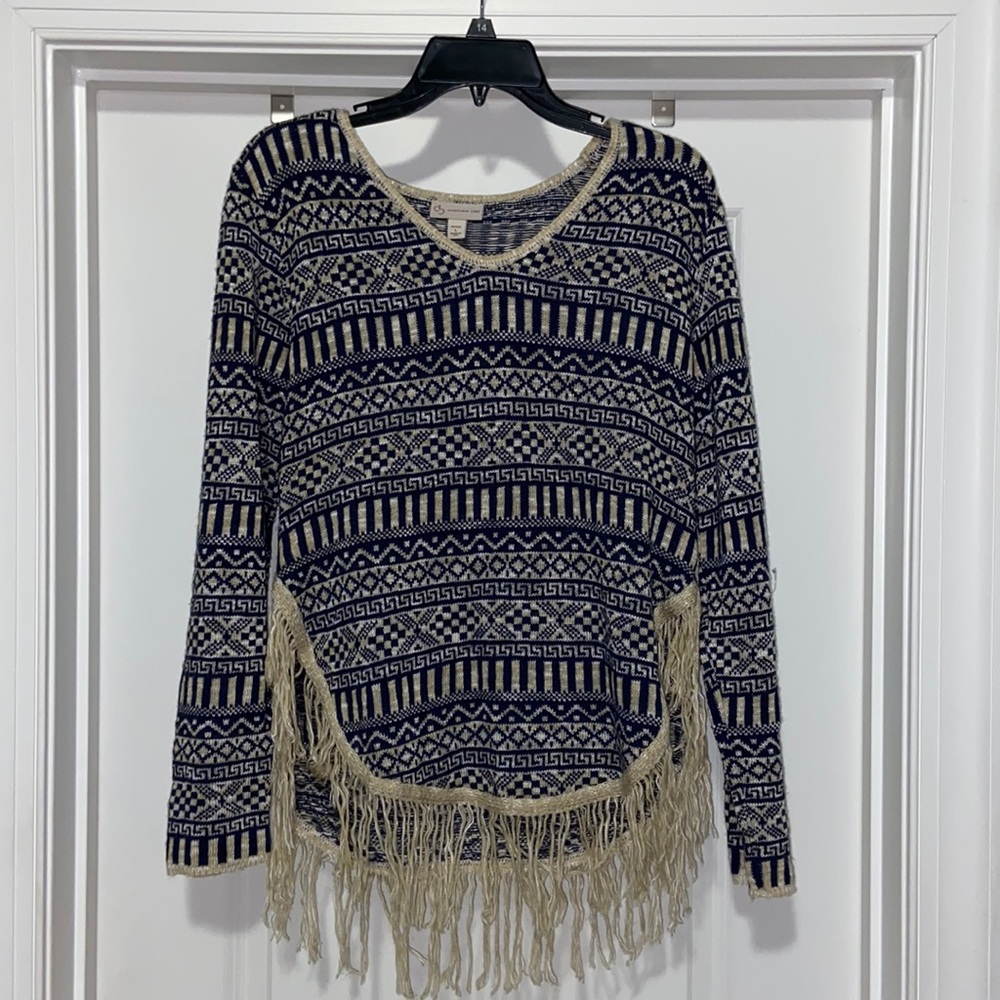 Navy blue and cream sweater with fringe bottom